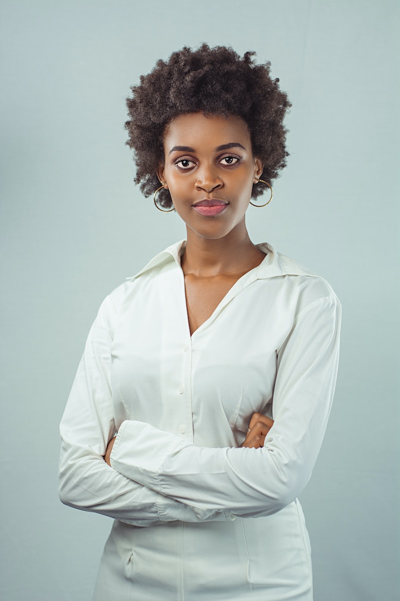 a woman in a white shirt posing for a picture